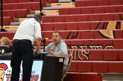 McKinney at the scoring speaking with an official prior to a Triton home volleyball match.